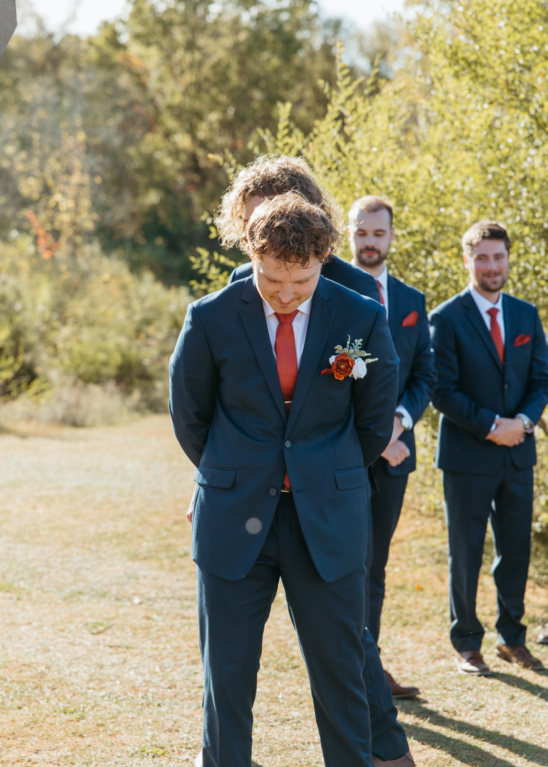 Professional Minneapolis wedding photography capturing the groom's ceremony entrance at Genesis Ranch, perfectly timed by D'Amore Wedding and Event Planning