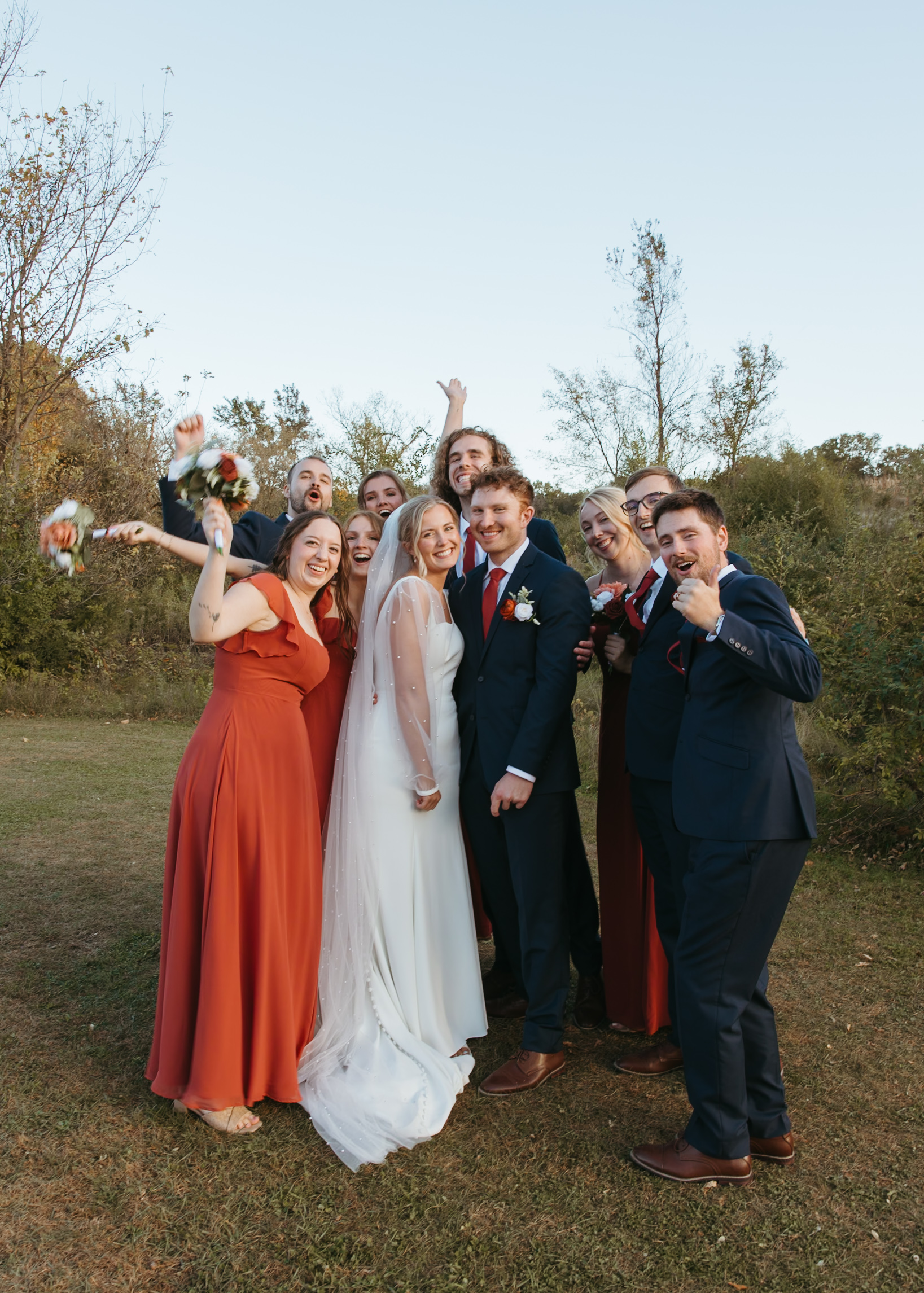 Professional Minneapolis wedding photography showing a candid wedding party photo at Genesis Ranch, beautifully styled by D'Amore Wedding and Event Planning.