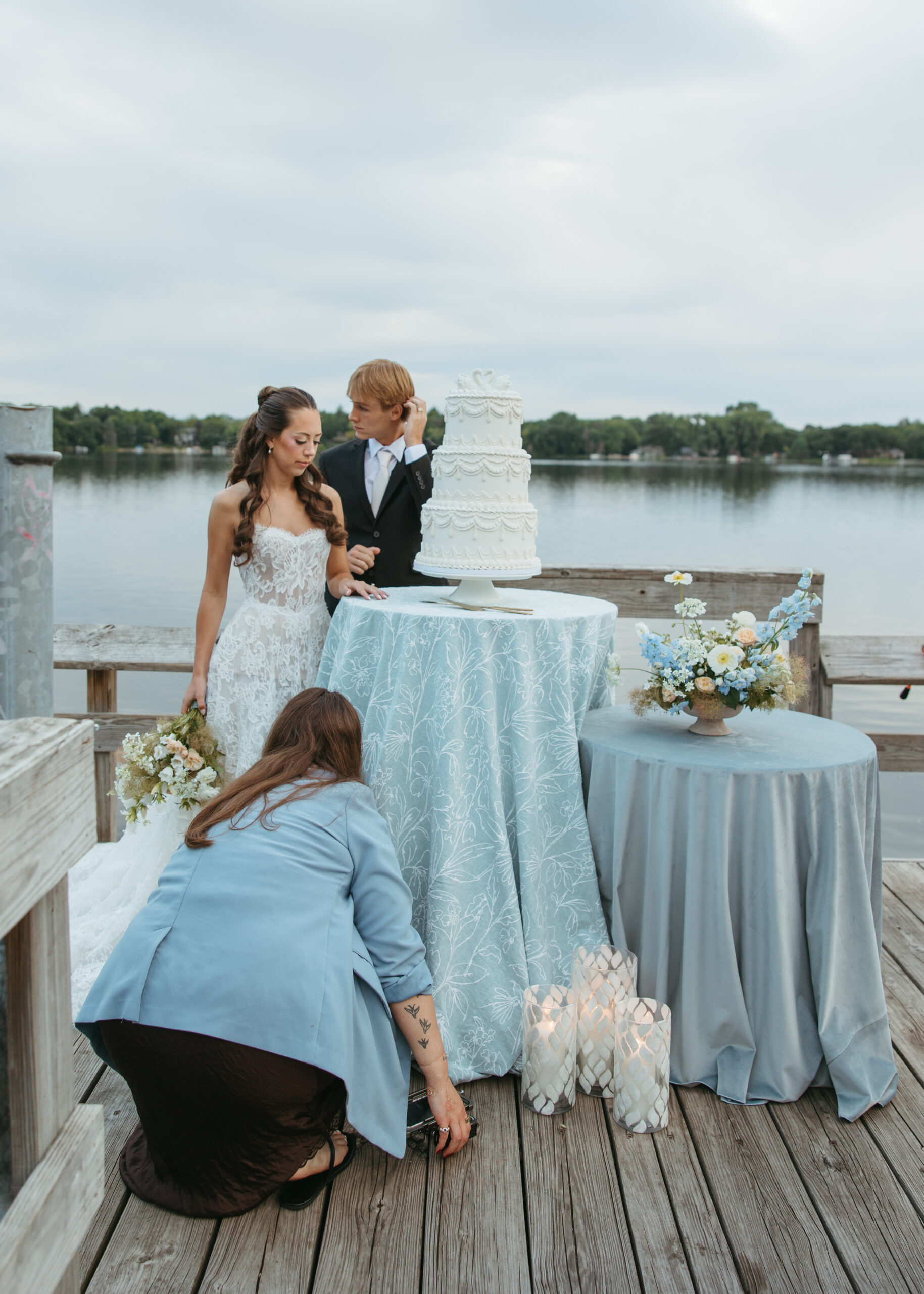 Romantic candid moment captured by Minneapolis wedding content creator Studio Zested during a lakeside shoot.