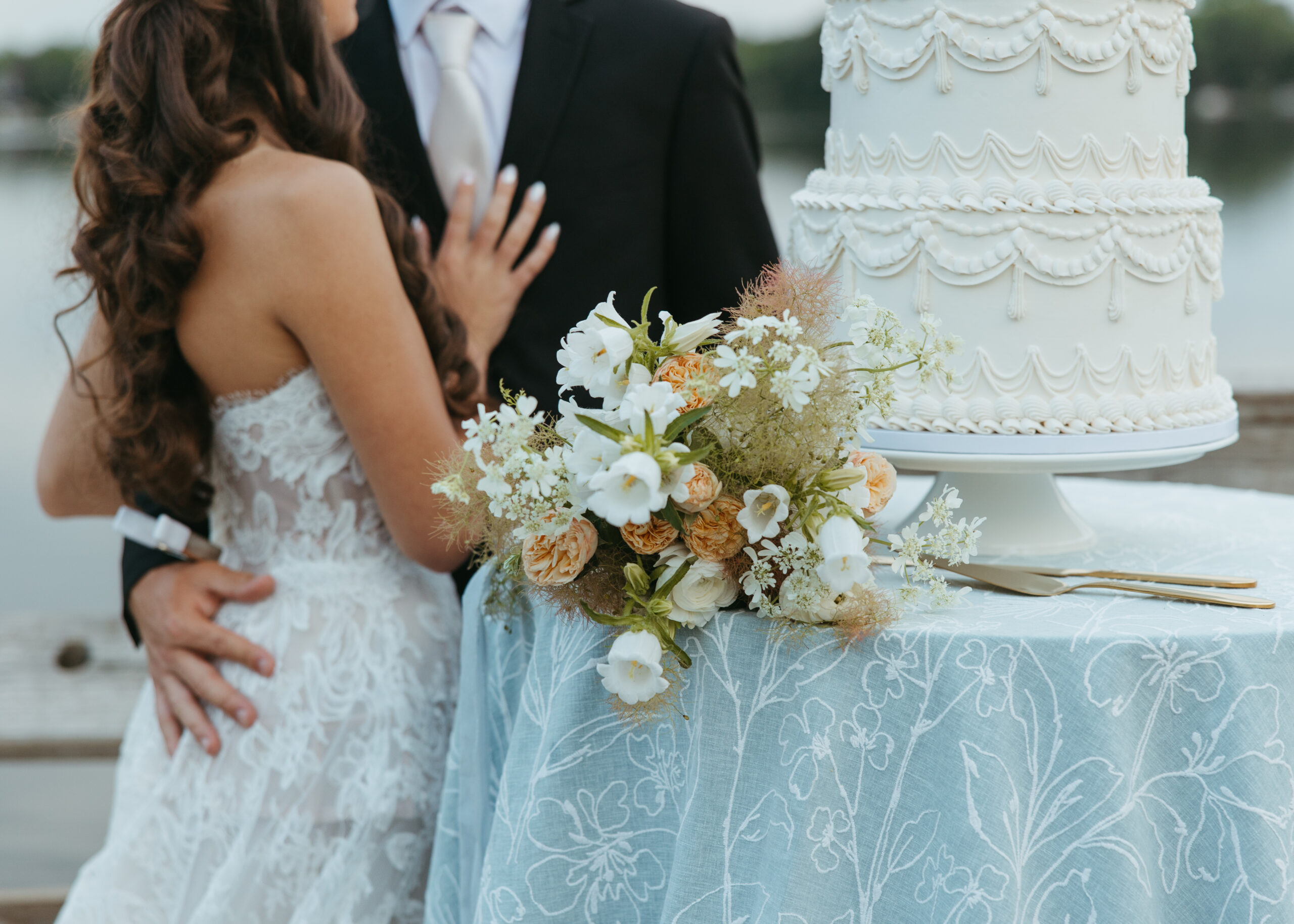 Golden hour sunset wedding portraits along the lake captured by a St. Paul Minneapolis wedding photographer.