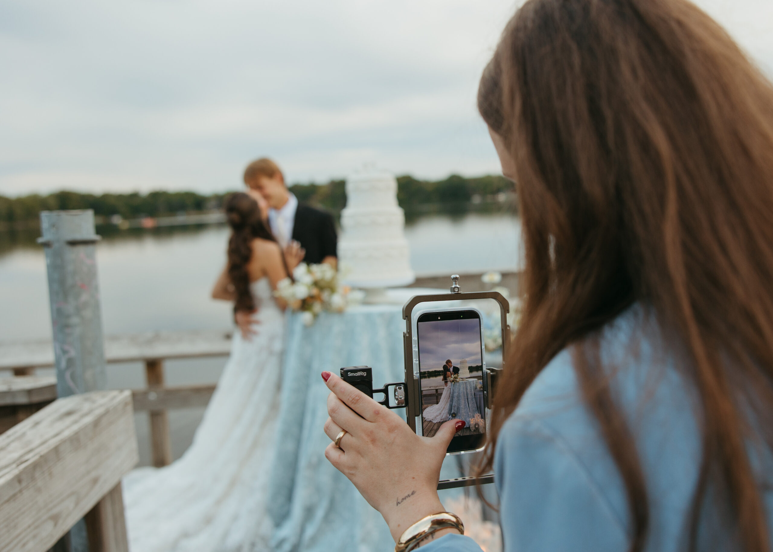 Romantic candid moment captured by Minneapolis wedding content creator Studio Zested during a lakeside shoot.