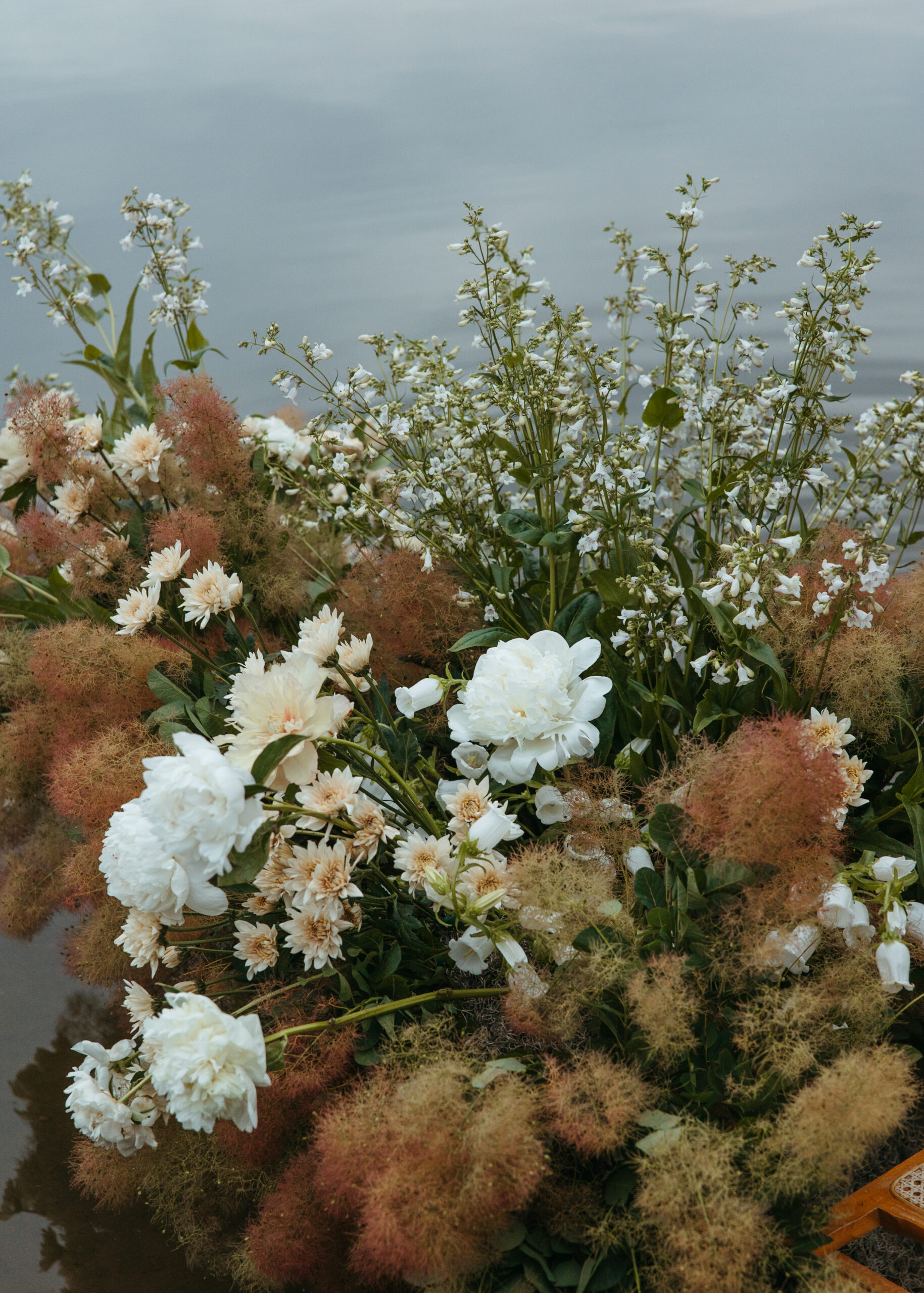 Organic white and blue coastal wedding florals designed by Reverie Floral Design for a Minneapolis lake shoot.