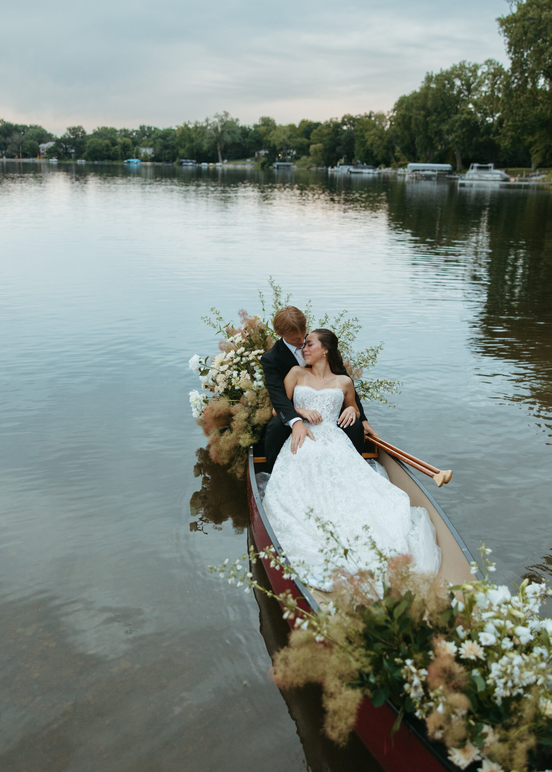 Golden hour sunset wedding portraits along the lake captured by a St. Paul Minneapolis wedding photographer.